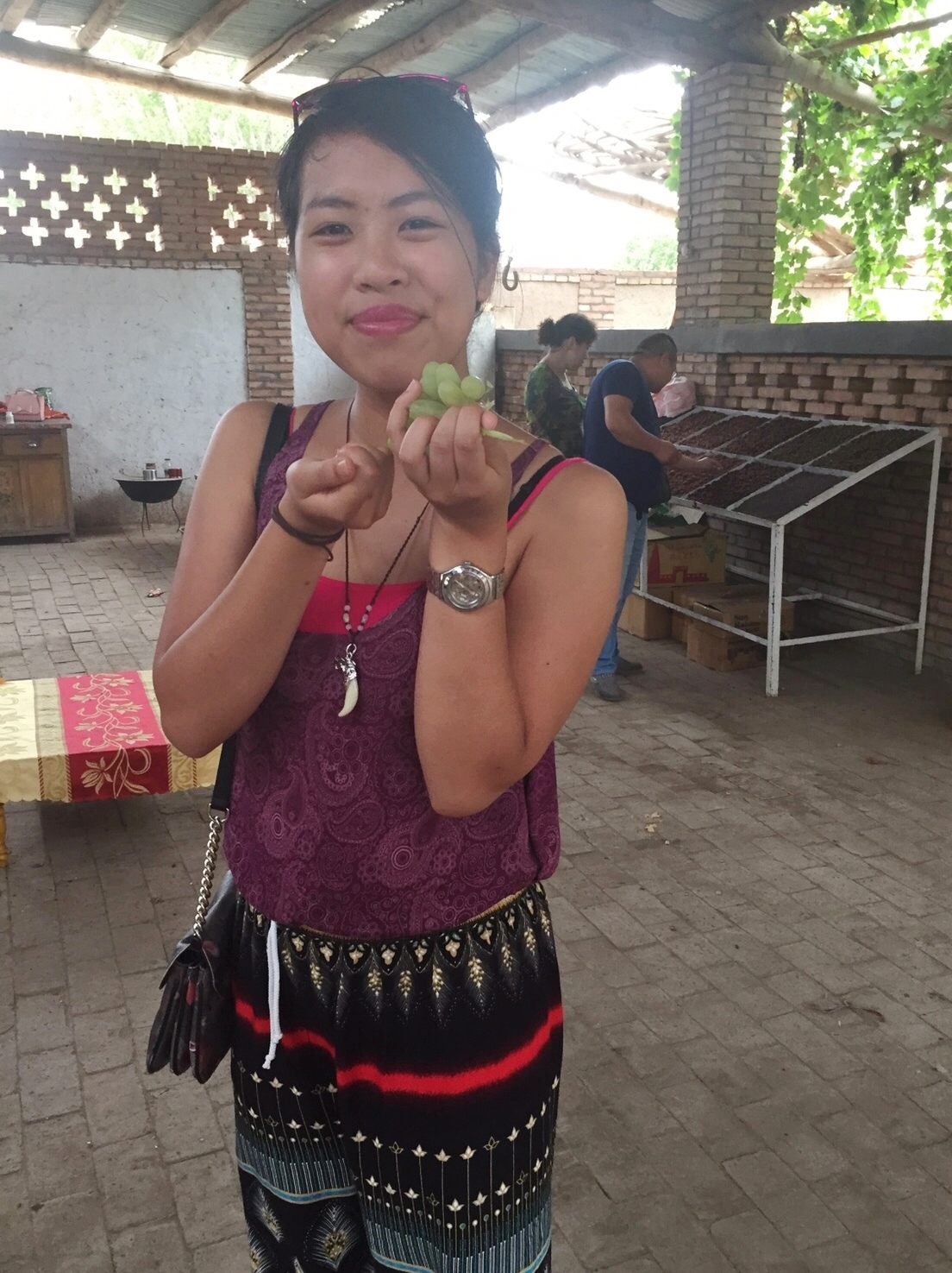 Emma enjoying the sweet seedless grapes freshly plucked and were still warm from the afternoon sun from our hospitable guide's back garden... wonderful experience!